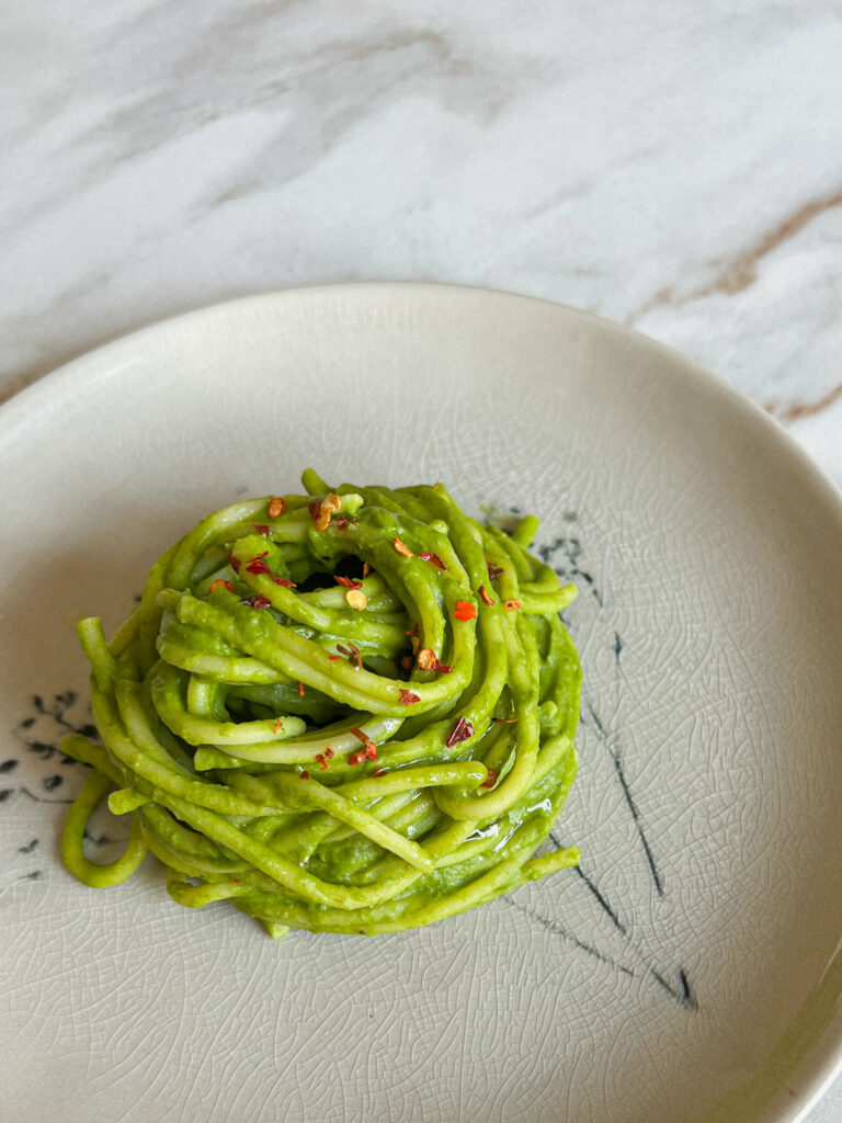 Green pasta with Parmesan cheese